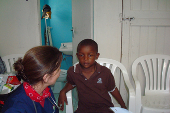 Meghan talks with a Jamaican boy